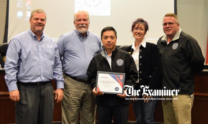 Examiner photo by Connie Clements: City council members recognize IT Specialist Hung Mai with a Certificate of Appreciation for five years of dedicated service to the City of Navasota. Pictured (L-R) Mayor Bert Miller, Mayor Pro Tem Grant Holt, Mai, council members Pattie Pederson and Josh Fultz. Article Image Alt Text