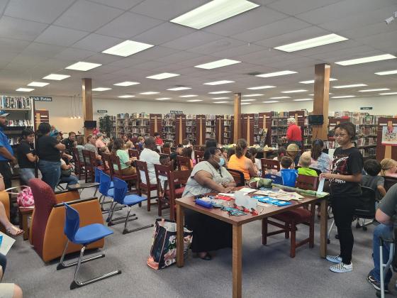 Children of all ages attended night one of Navasota Public Library's Summer Reading Program, "Oceans of Possibilities" Monday, June 6. The evening featured a presentation by the Houston Museum of Natural Science and free snow cones from Navasota Noon Lion Article Image Alt Text
