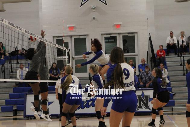 Navasota senior Kylie Walter-Steptoe nearly had to duck to prevent hitting the gymnasium ceiling as she elevates to send an unreturnable spike to Hempstead during action Tuesday, Aug. 23, at Rattler Gym. The Lady Rattlers beat the Lady Bobcats 3-0. Examin Article Image Alt Text