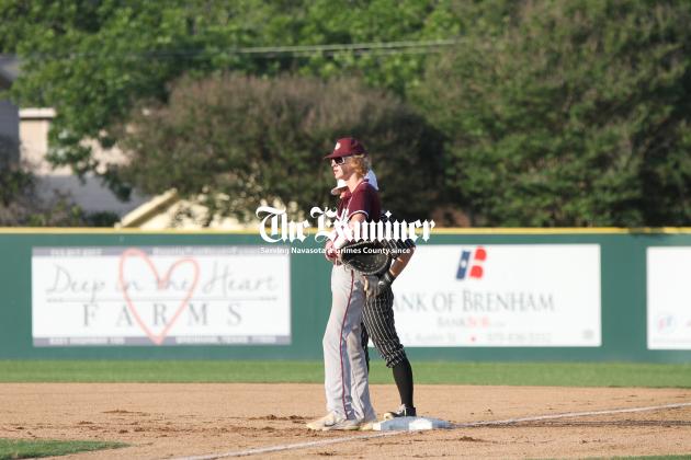 CADEN JORDAN Examiner photo by Matthew Ybarra Iola first baseman Caden Jordan gazes toward the mound waiting for his pitcher to toe the rubber in 2A Region IV action against the Johnson City Eagles. Article Image Alt Text