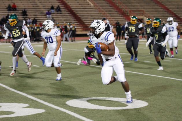 Examiner photo by Matthew Ybarra Darius Randle totes the ball 47-yards for one of his four touchdowns in the Rattlers 49-15 win over Worthing. Navasota remains undefeated in District 12-4A Article Image Alt Text
